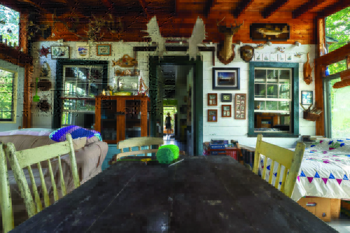 A photo of the cottage's interior with one of Christina's grandchildren in the distance.