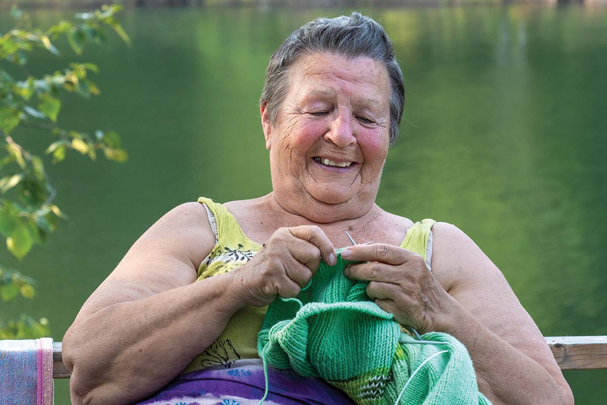 Christina sits and knits.