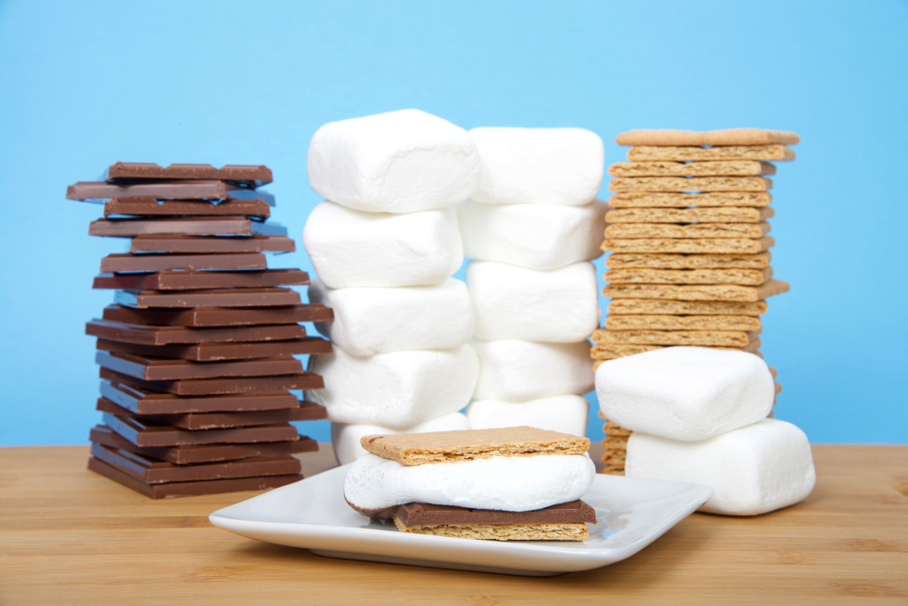 A large stack of s'mores ingredients