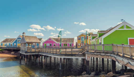 colourful buildings on a dock elevated out of the water dot the Summerside waterfront (Prince Edward Island, Canada)