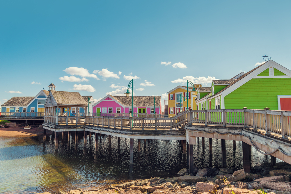 colourful buildings on a dock elevated out of the water dot the Summerside waterfront (Prince Edward Island, Canada)