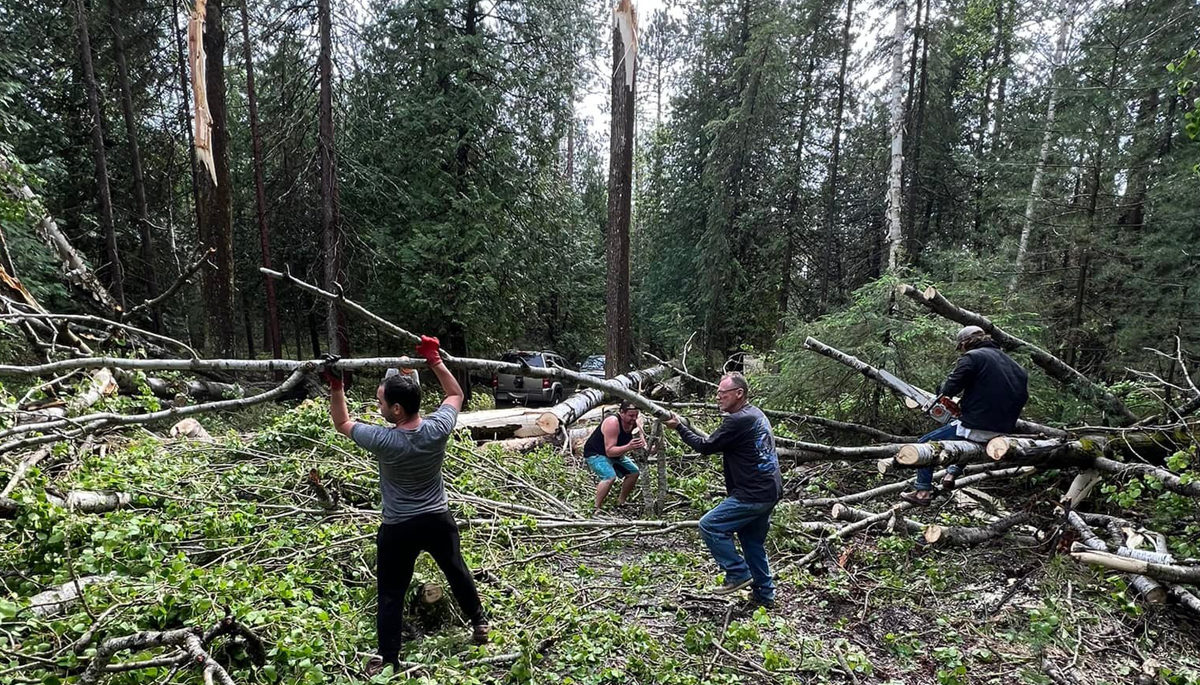 Jack Lake cottagers come together as a community and help each other with cleanup efforts from the May 21 storm.