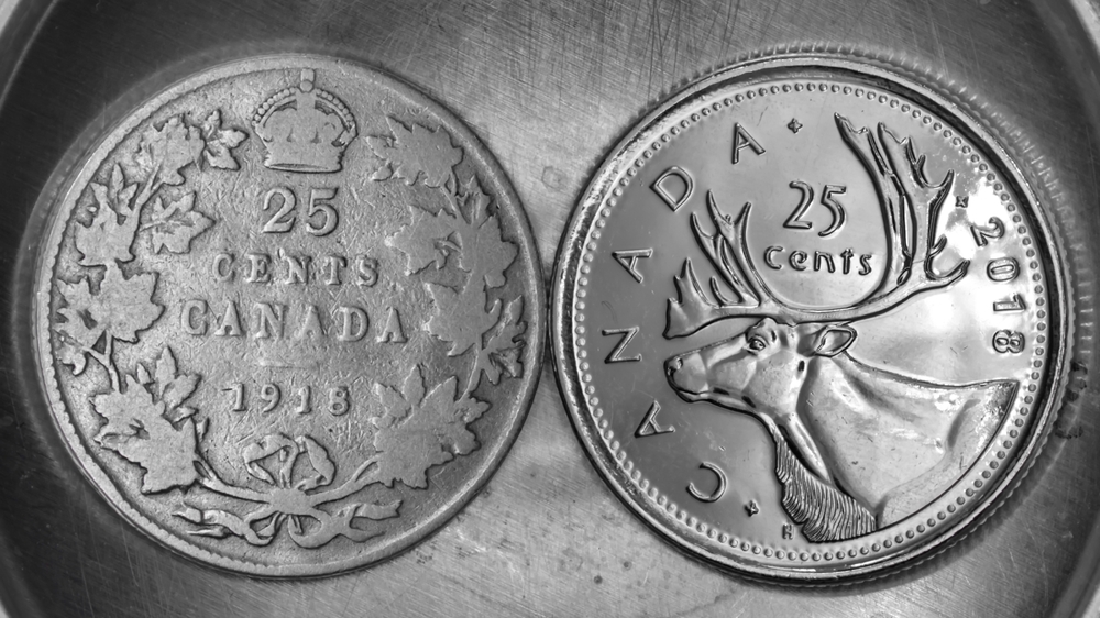 An old Canadian quarter and a new one