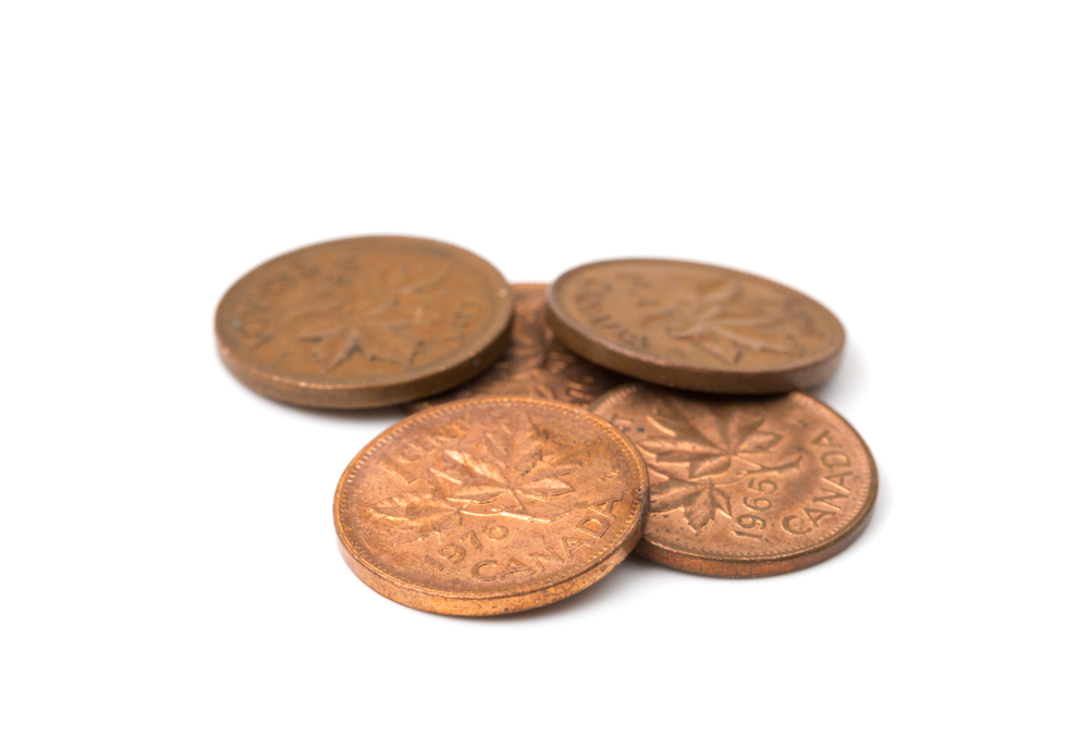 Several Canadian pennies against a white background