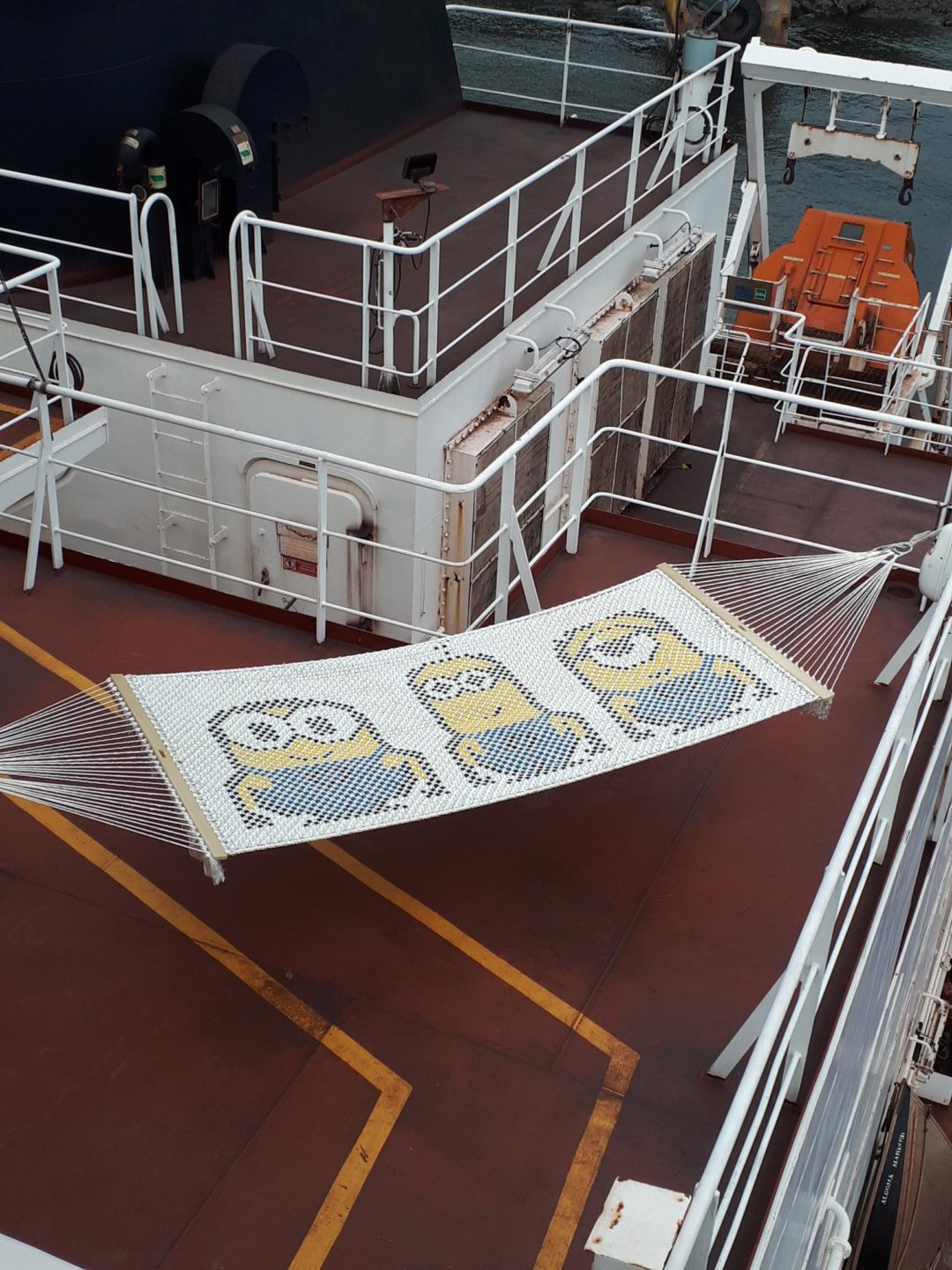 A minion-themed hammock strung on the boat