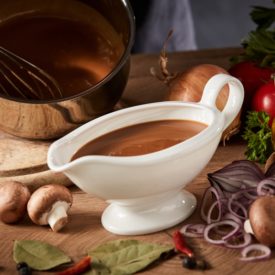 gravy boat being poured