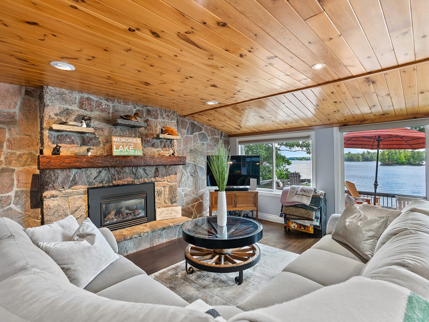 Stone fireplace surrounded by large couch