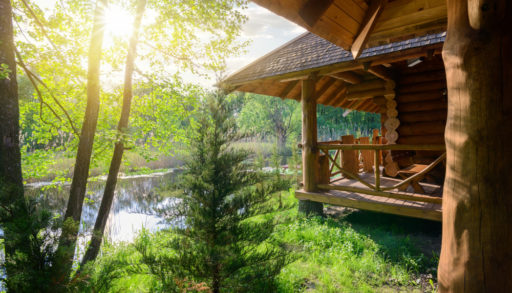 A wood cabin overlooking a river