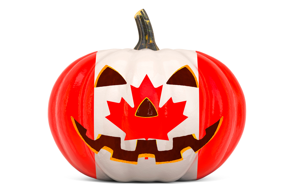 A carved pumpkin painted with the Canadian flag