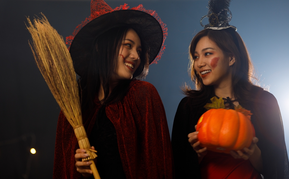 Two teenage girls dressed in costume for Halloween