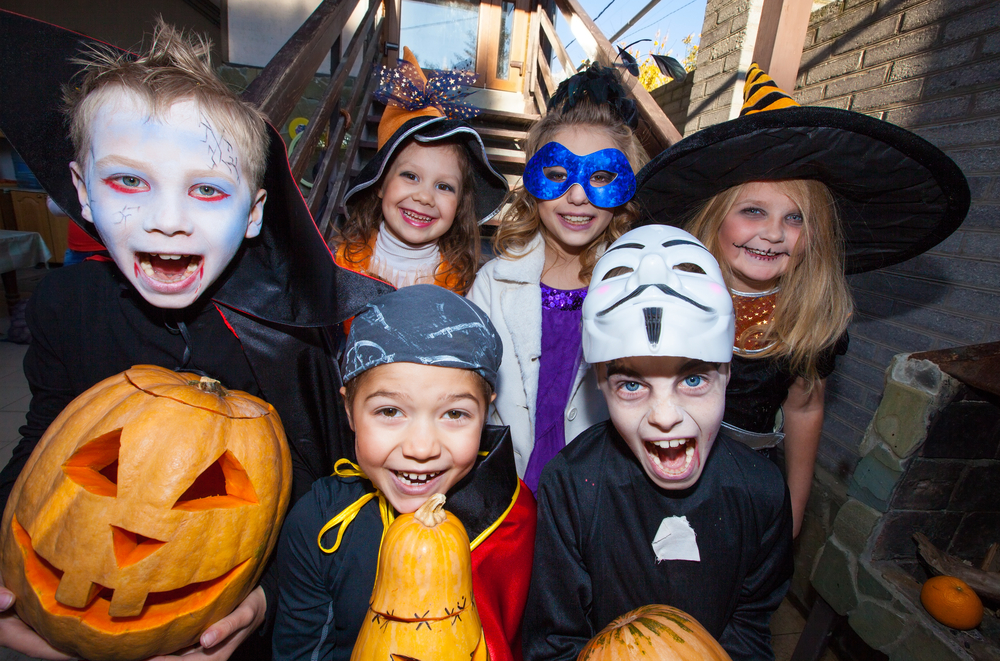 A group of kids trick or treating