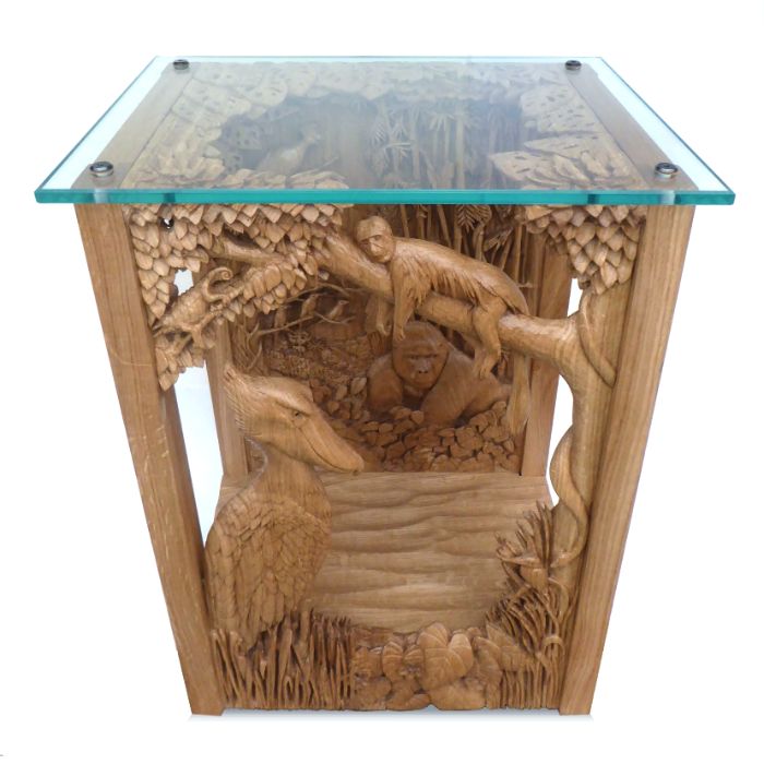 A carved, jungle-themed table