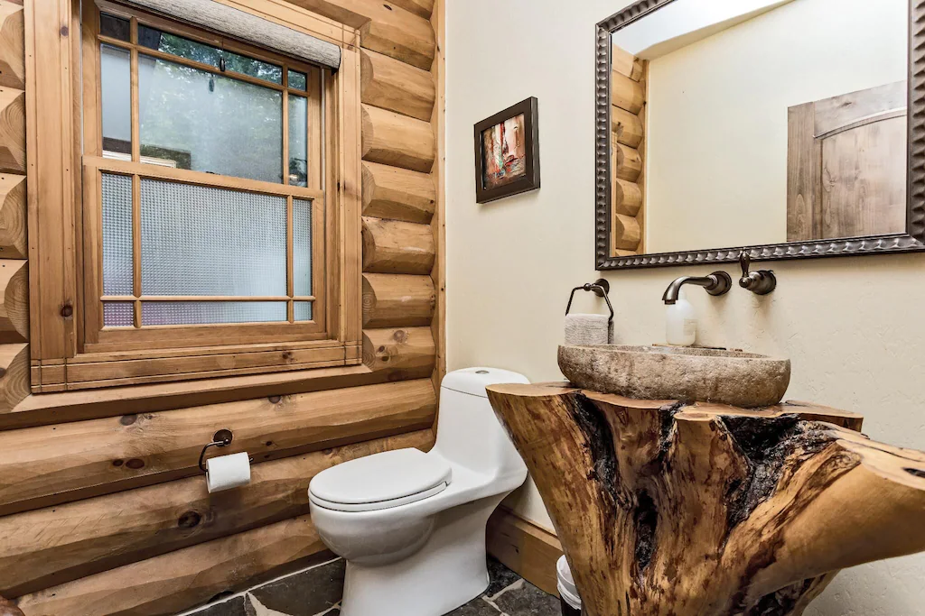bathroom with wooden trunk sink