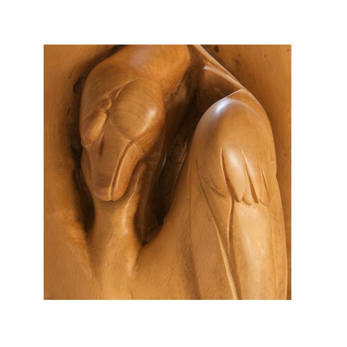 A close up of a snake and swan carving