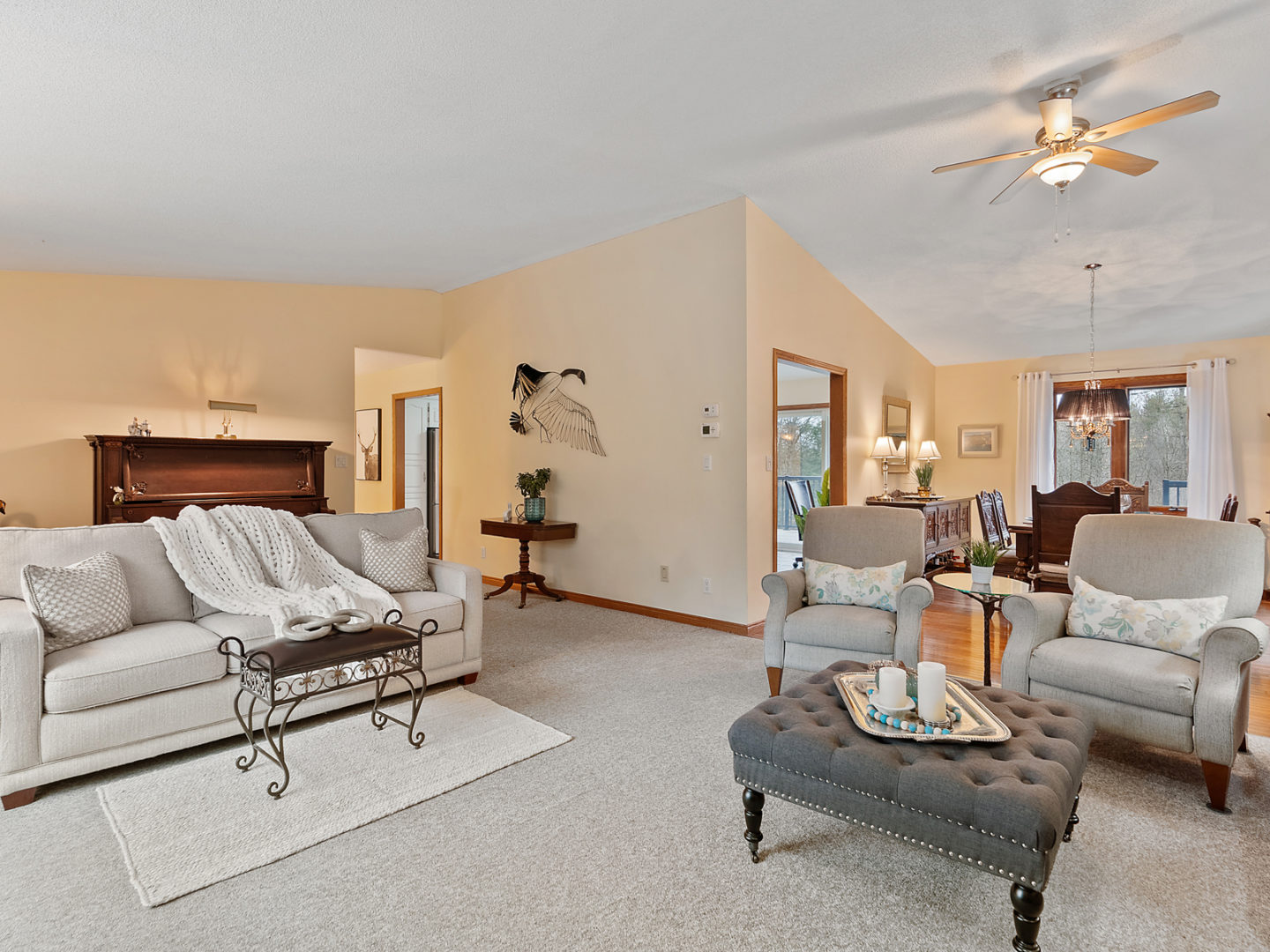 A large open-concept living room looking into a dining area.