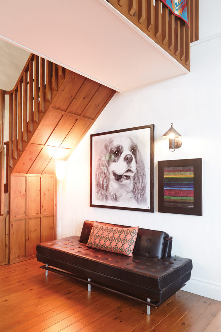 large picture of dog hanging on wall