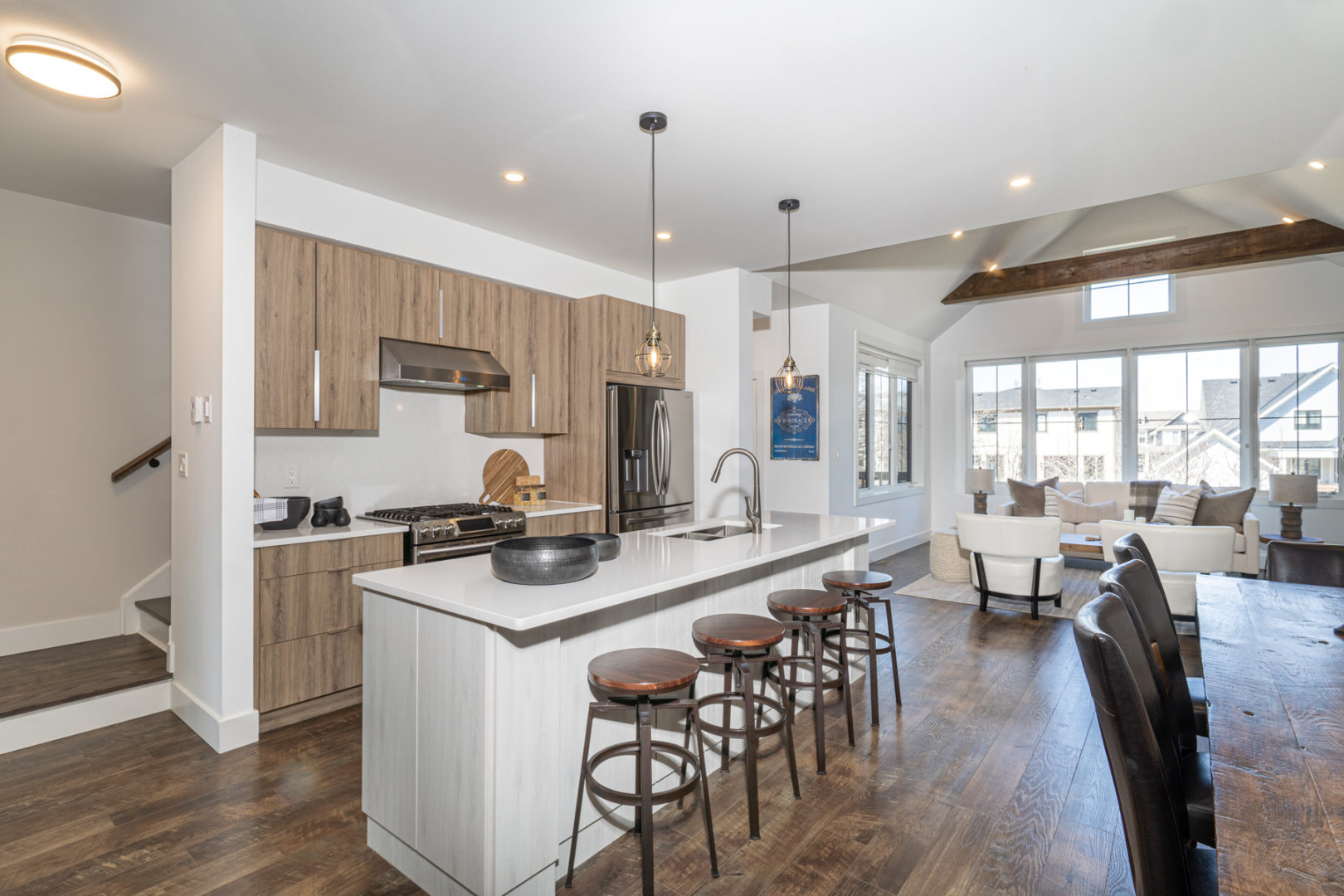 A spacious kitchen area with a large island and updated appliances.