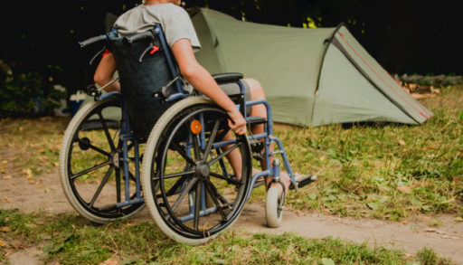 Man in wheelchair at a campground