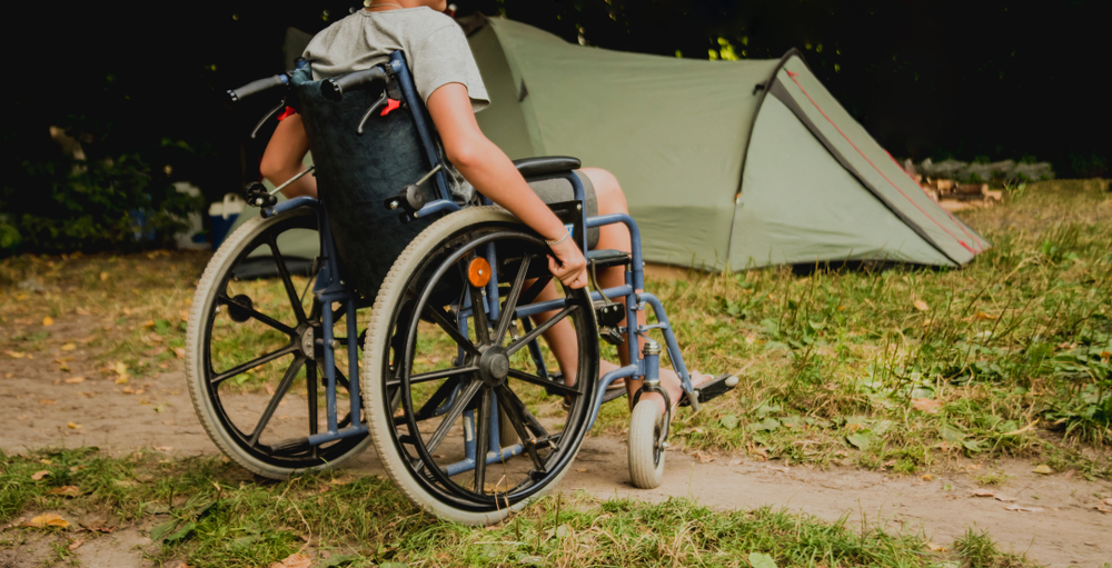 Man in wheelchair at a campground