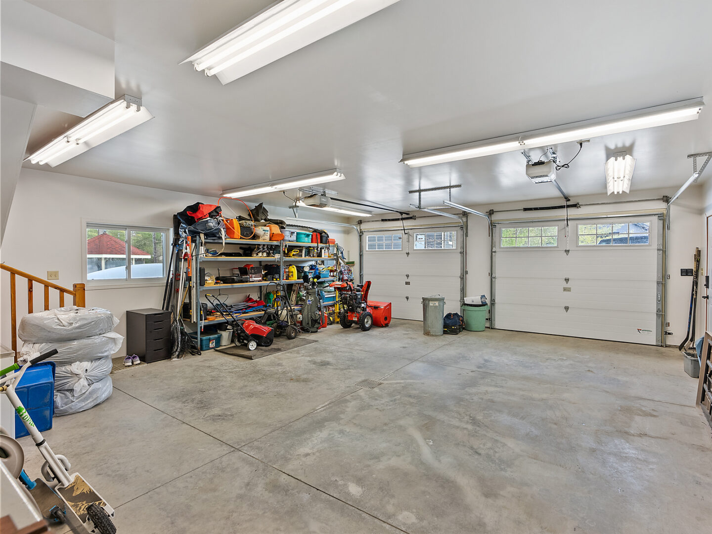 Inside a big two-car garage with lots of free space.