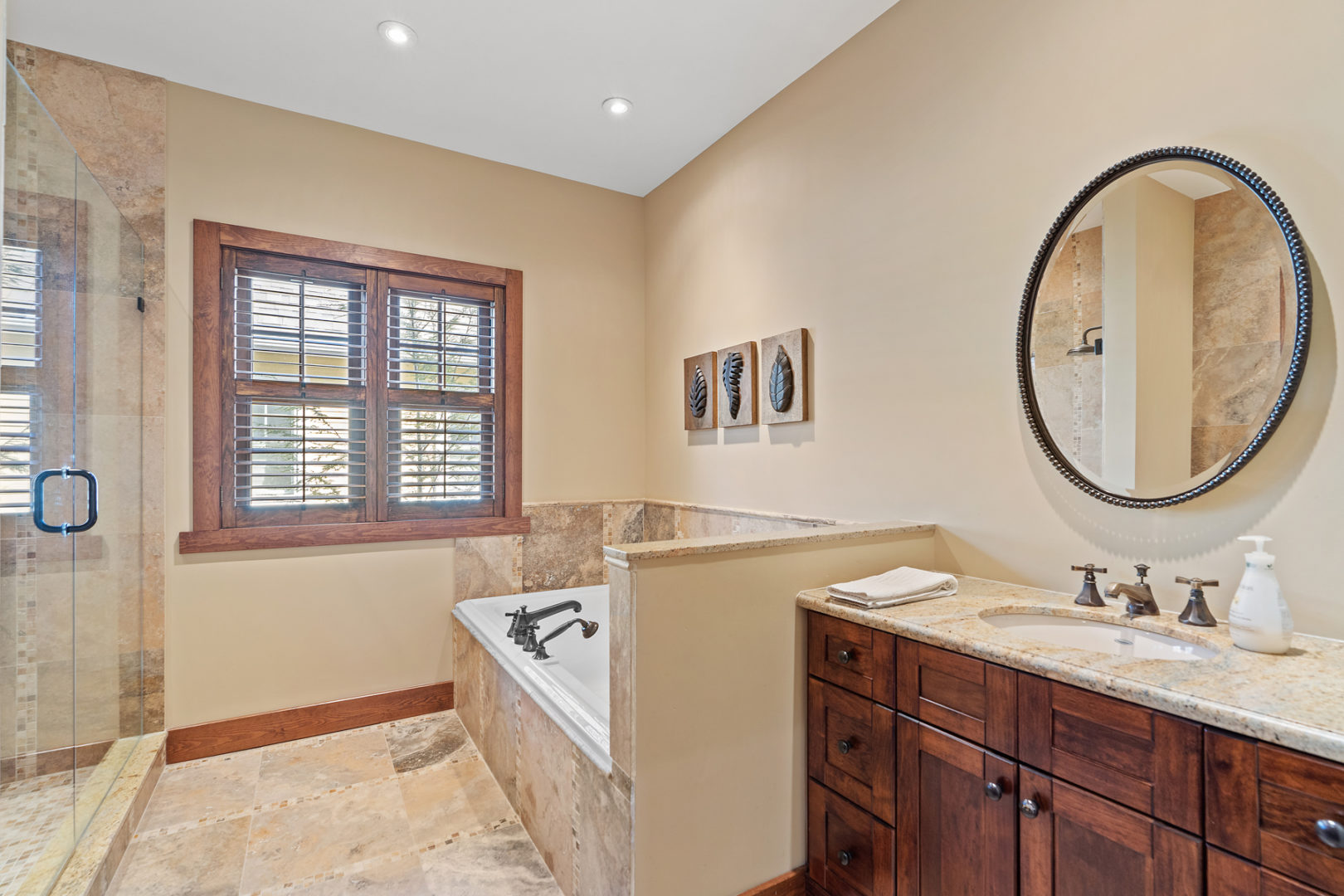 A bright bathroom with a bathtub and a sink.