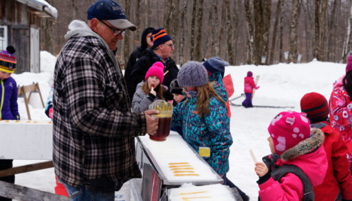 Kids eating maple taffy