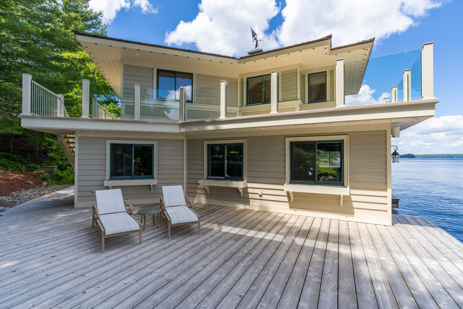 A large dock with a big, two-storey boathouse.