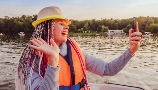 woman on boat taking a selfie