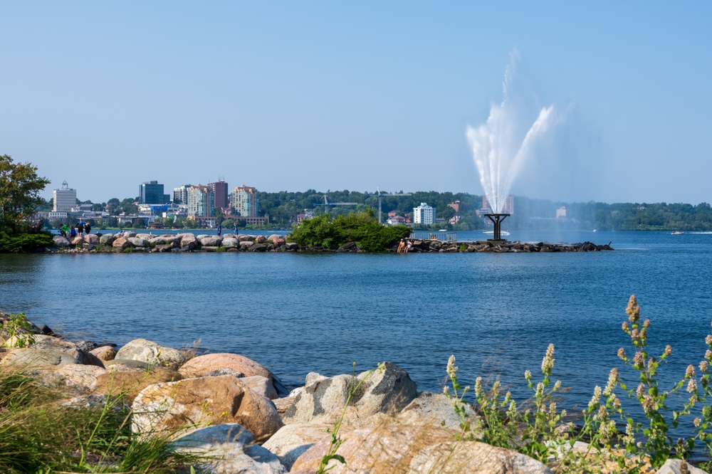 Centennial Beach in Barrie with fountain on a small rocky peninsula