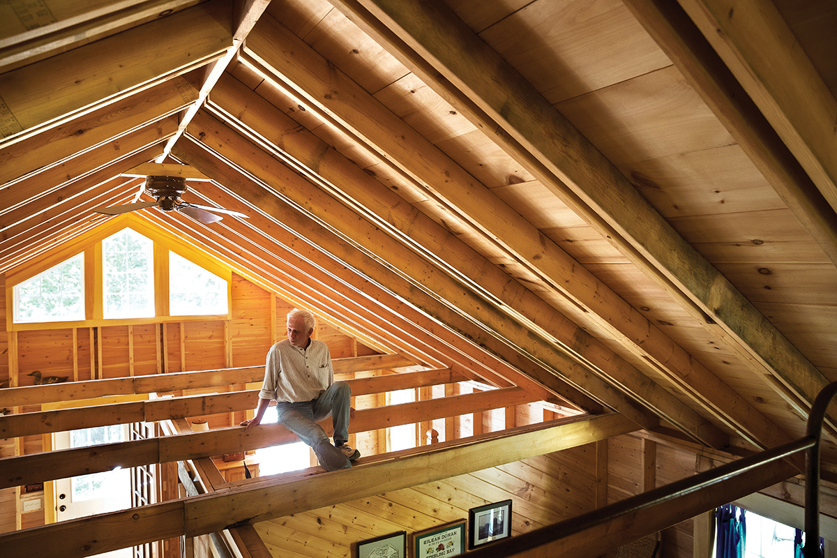 Albert Crowder sitting in the rafters of his cottage