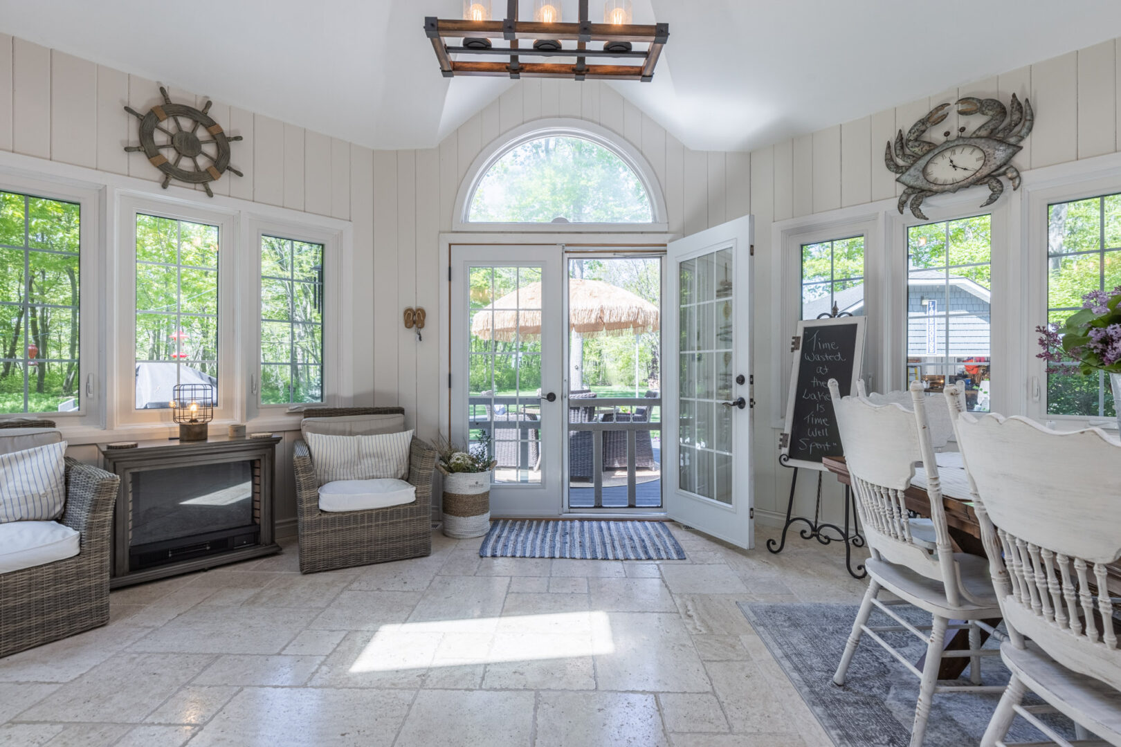 A bright, double-door back entryway to a modern cottage kitchen area.