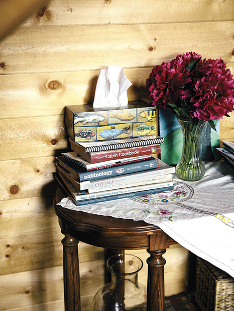 stack of books with tissue box on top