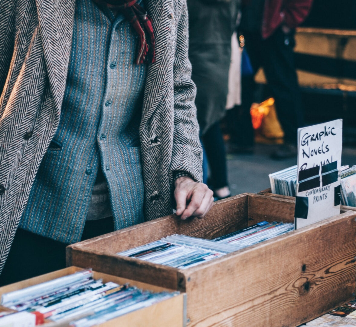 man looks through graphic novel boxes at The 400 Flea Market in Innisfil
