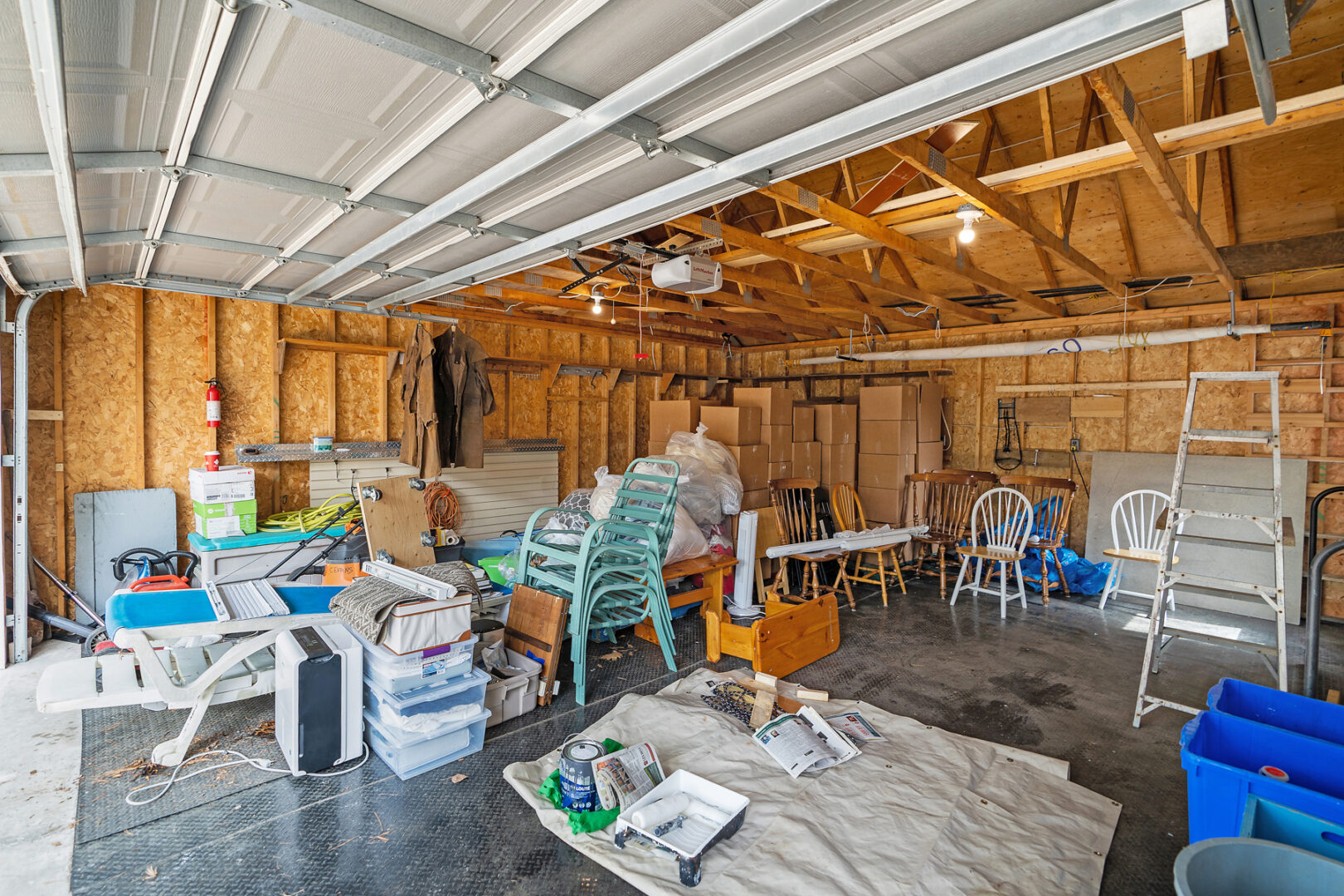 A large, unfinished garage with lots of room for storage.