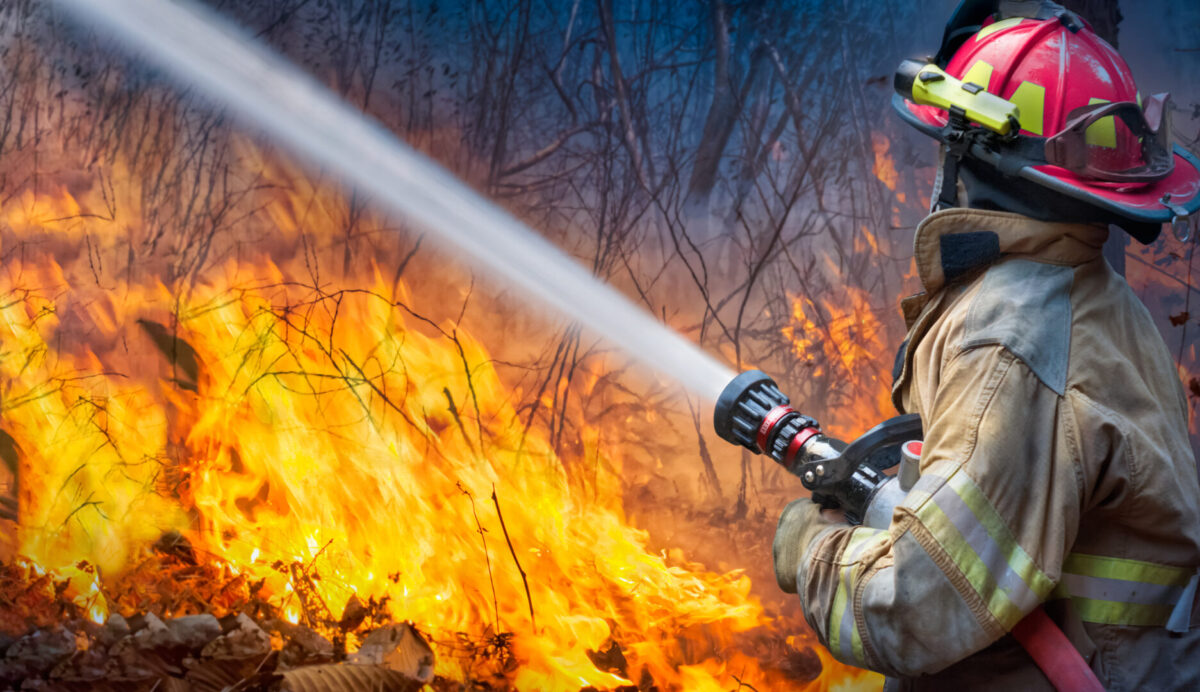 Firefighter putting out flames