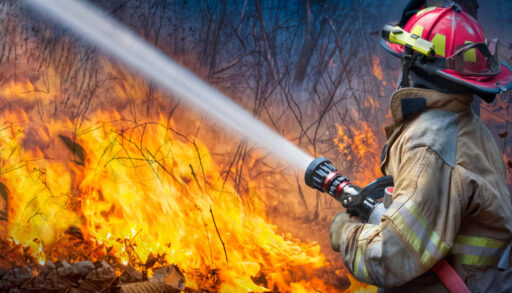 Firefighter putting out flames
