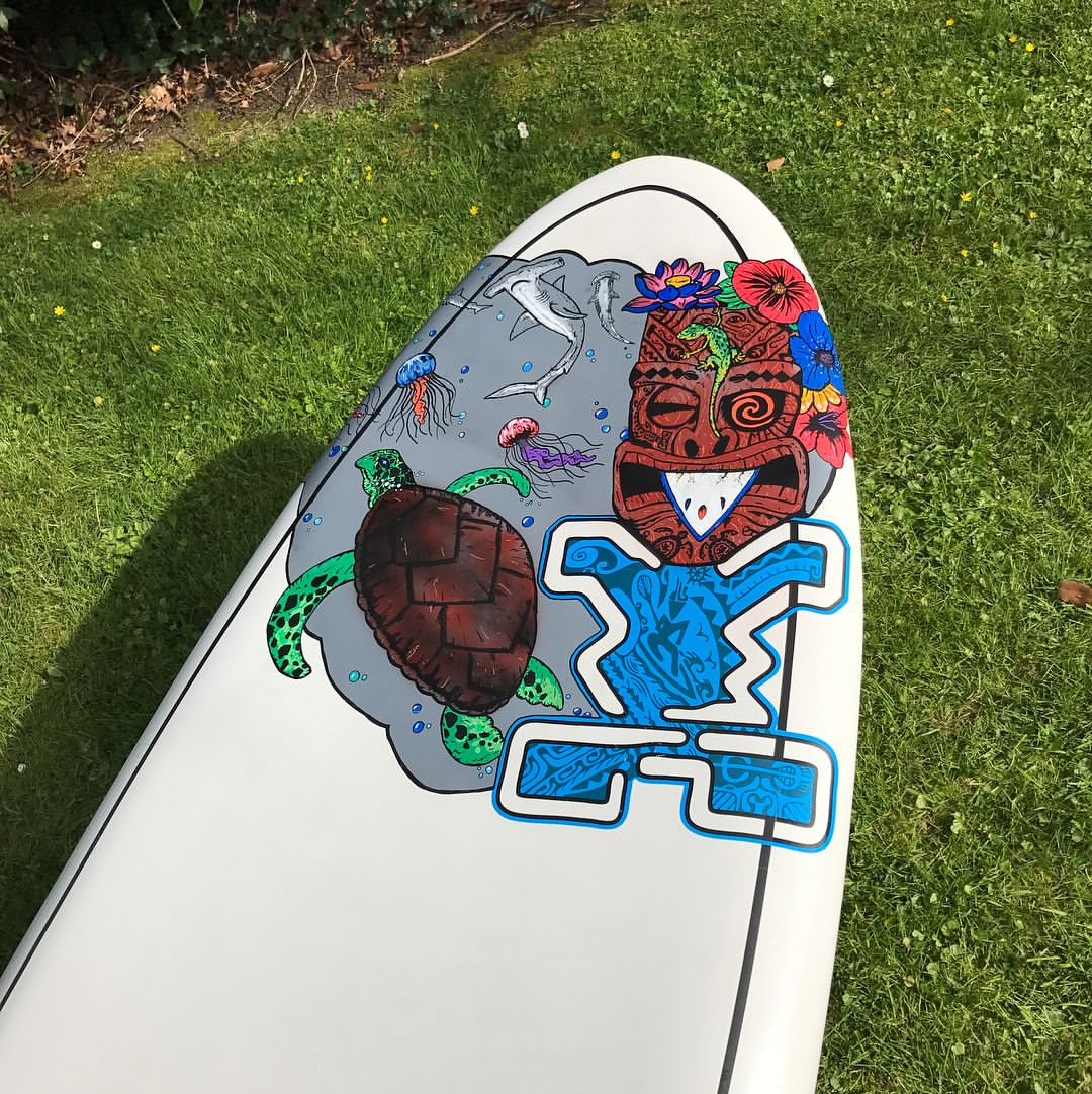 paddleboard with turtle and tiki painting