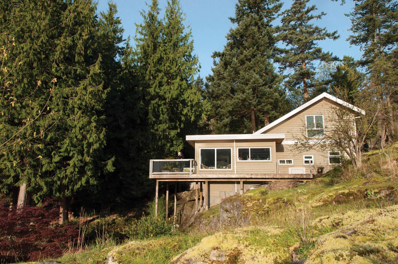 Exterior shot of cottage on rocky slope