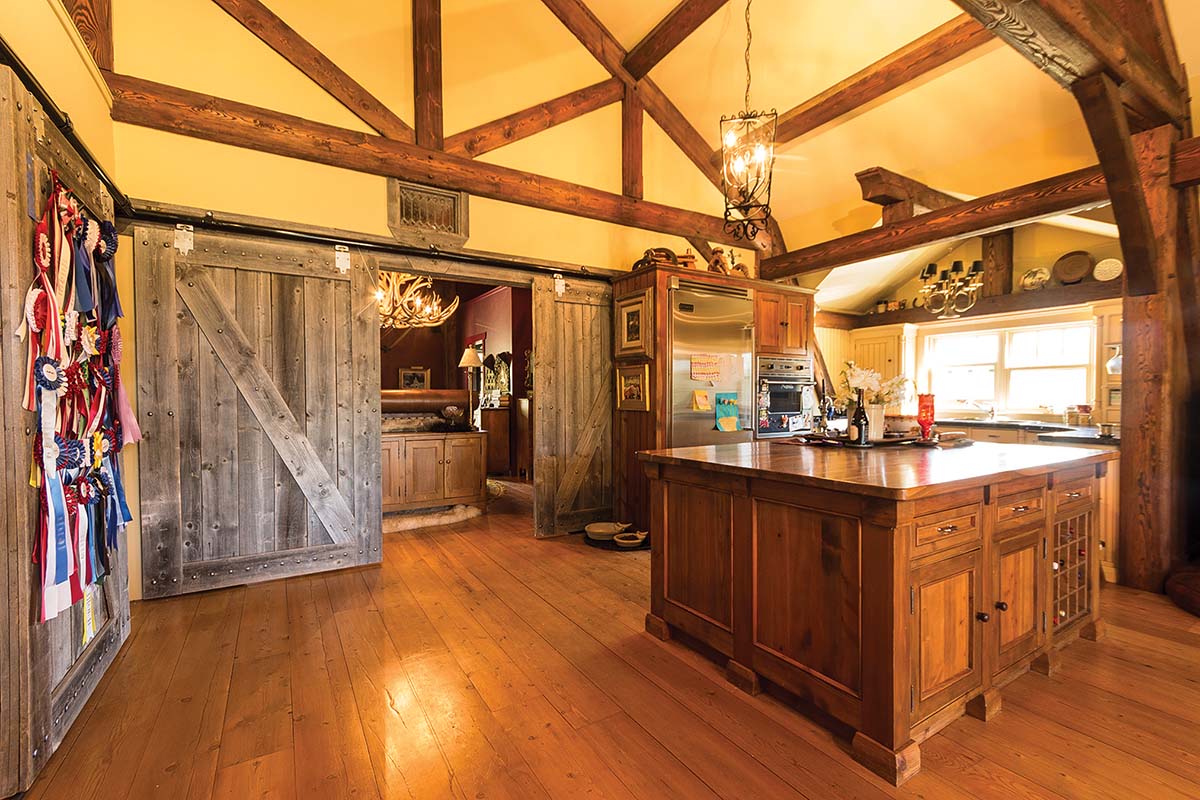 Butler's kitchen featuring sliding barn doors