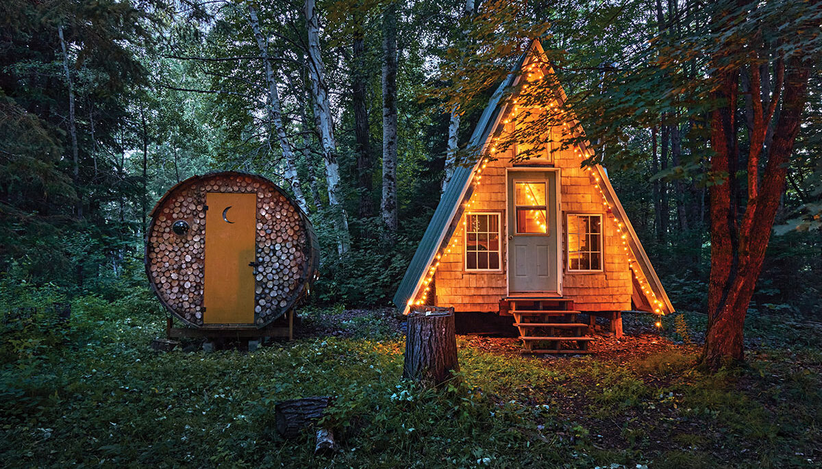 The A-frame lit up with fairy lights at night