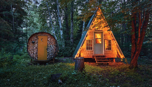 The A-frame lit up with fairy lights at night