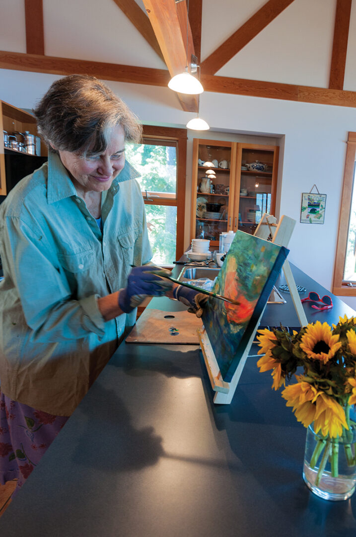 Marianne with one of her paintings