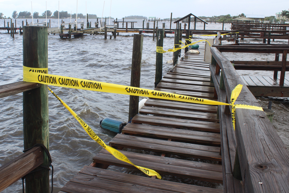 caution tape cordons off a dock