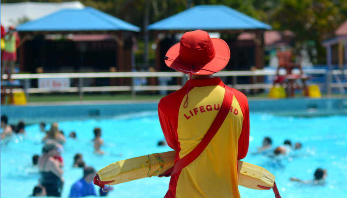 Lifeguard watching over public pool