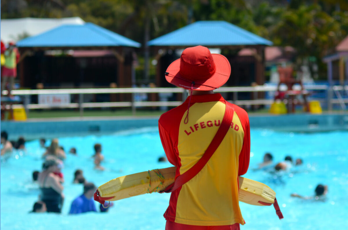 Lifeguard watching over public pool