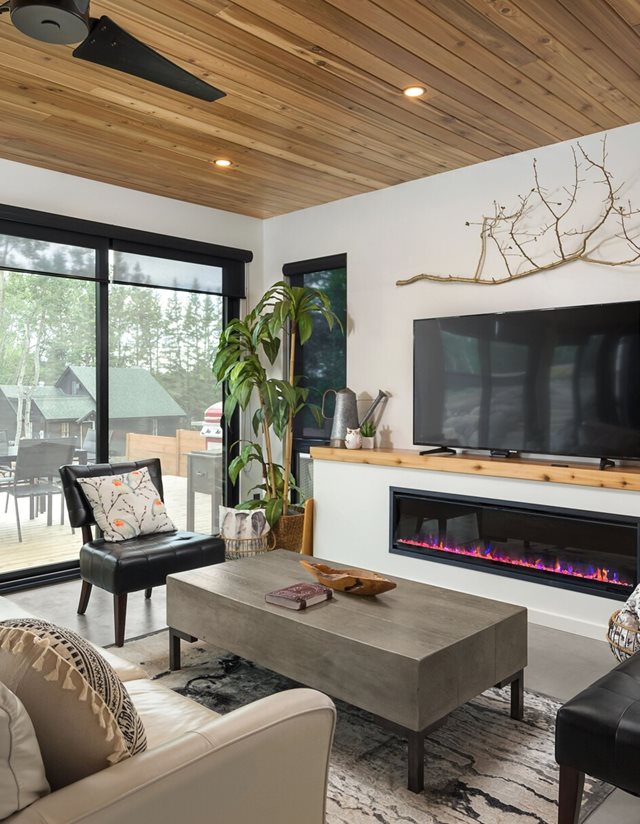 living room with tv fireplace and beige furniture