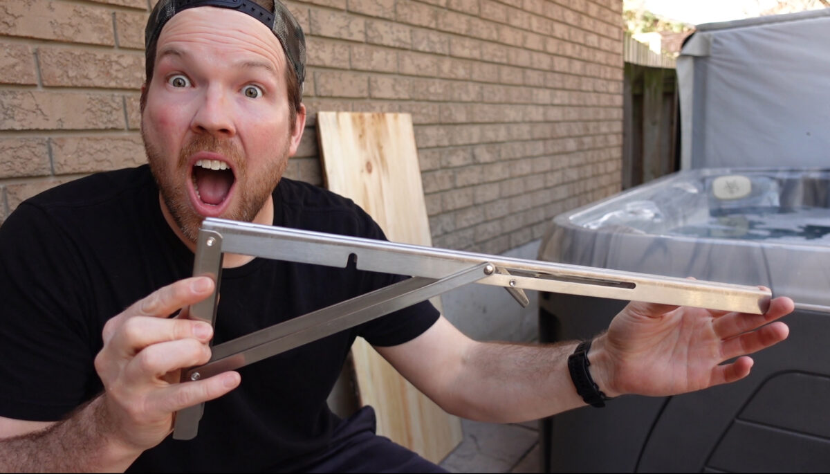 Adam Holman holding a bracket