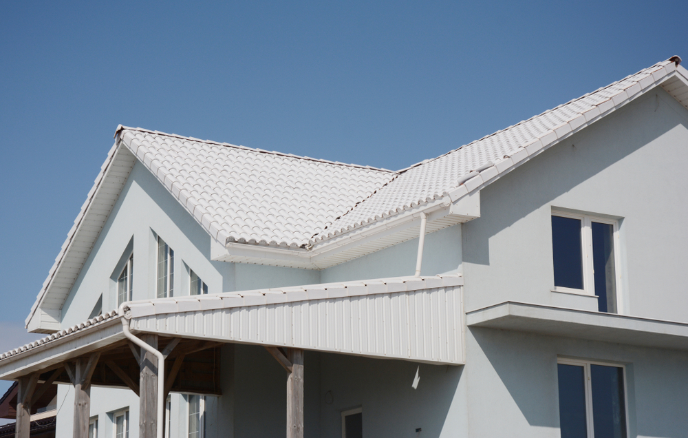 An energy-efficient house with a white roof