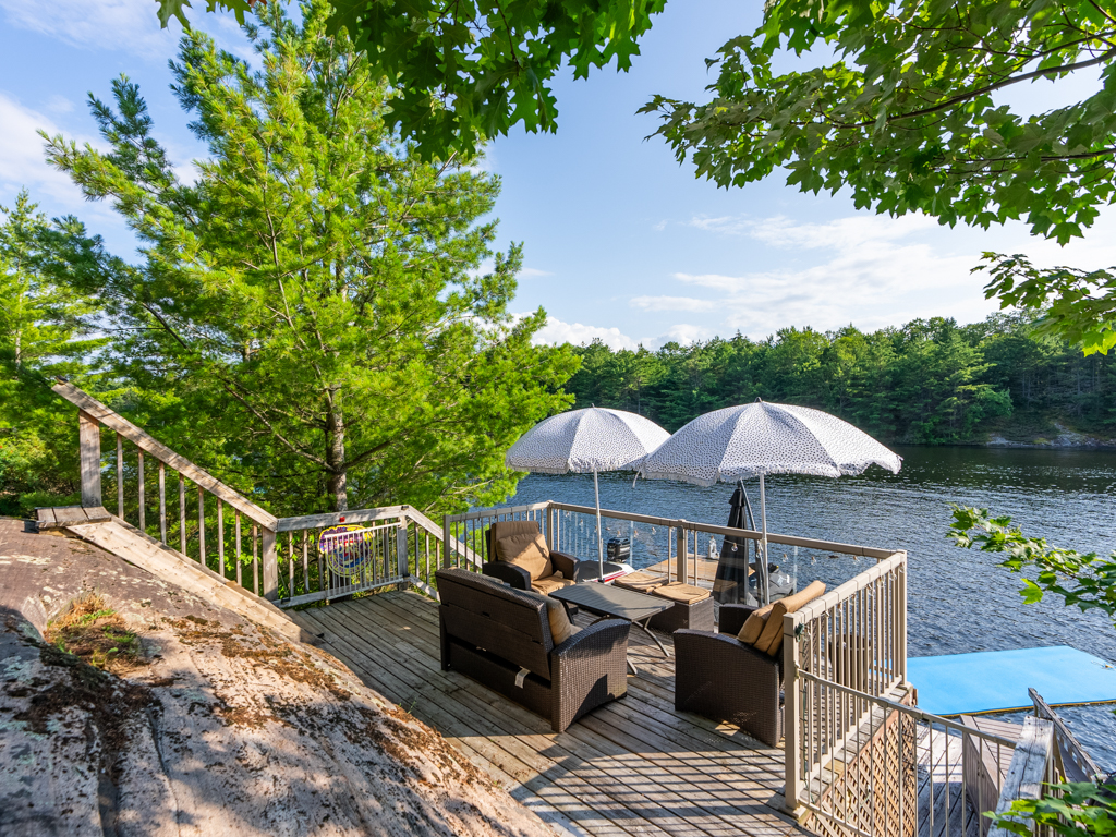A small deck looking out over the lake.