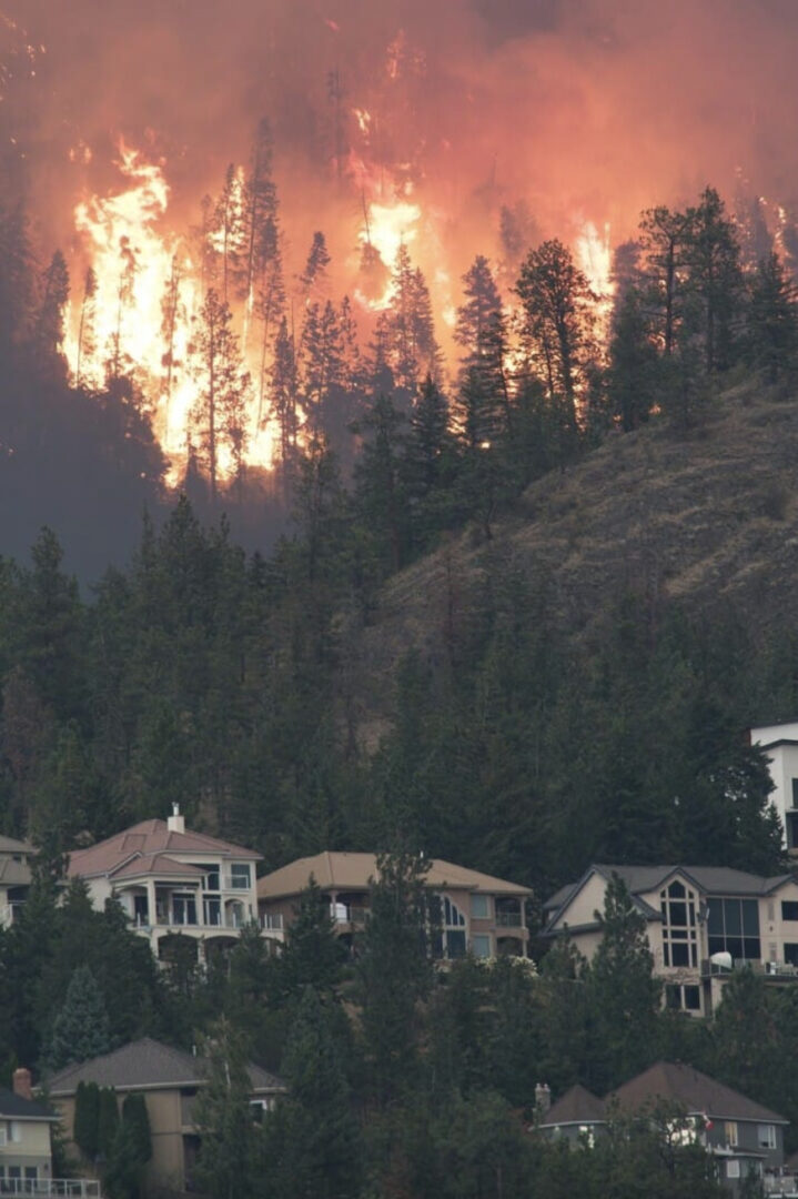 Fire rages close to homes